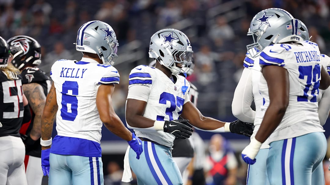 Aug 22, 2025; Arlington, Texas, USA;  Dallas Cowboys running back Phil Mafah (37) celebrates with teammates after scoring a touchdown during the second half against the Atlanta Falcons at AT&T Stadium.