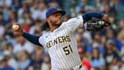 Sep 28, 2025; Milwaukee, Wisconsin, USA; Milwaukee Brewers starting pitcher Freddy Peralta (51) throws against the Cincinnati Reds in the first inning at American Family Field. Mandatory Credit: Benny Sieu-Imagn Images
