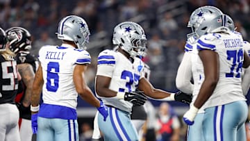 Aug 22, 2025; Arlington, Texas, USA;  Dallas Cowboys running back Phil Mafah (37) celebrates with teammates after scoring a touchdown during the second half against the Atlanta Falcons at AT&T Stadium.