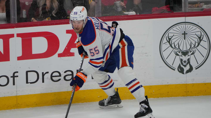 Jun 18, 2024; Sunrise, Florida, USA; Edmonton Oilers forward Dylan Holloway (55) controls the puck against the Florida Panthers during the first period in game five of the 2024 Stanley Cup Final at Amerant Bank Arena. Mandatory Credit: Jim Rassol-USA TODAY Sports