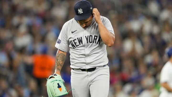 Jun 29, 2024; Toronto, Ontario, CAN; New York Yankees pitcher Nestor Cortes (65) adjusts his hat after the first inning at an MLB game against the Toronto Blue Jays at Rogers Centre. Mandatory Credit: Kevin Sousa-USA TODAY Sports