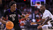 Feb 22, 2025; Cincinnati, Ohio, USA; TCU Horned Frogs guard Vasean Allette (3) dribbles against Cincinnati Bearcats guard Jizzle James (2) in the second half at Fifth Third Arena. Mandatory Credit: Katie Stratman-Imagn Images
