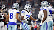Dallas Cowboys running back Phil Mafah celebrates with teammates after scoring a touchdown against the Atlanta Falcons