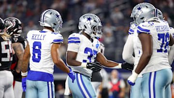 Dallas Cowboys running back Phil Mafah celebrates with teammates after scoring a touchdown against the Atlanta Falcons