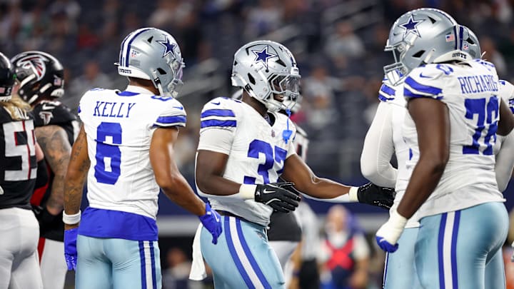 Dallas Cowboys running back Phil Mafah celebrates with teammates after scoring a touchdown against the Atlanta Falcons