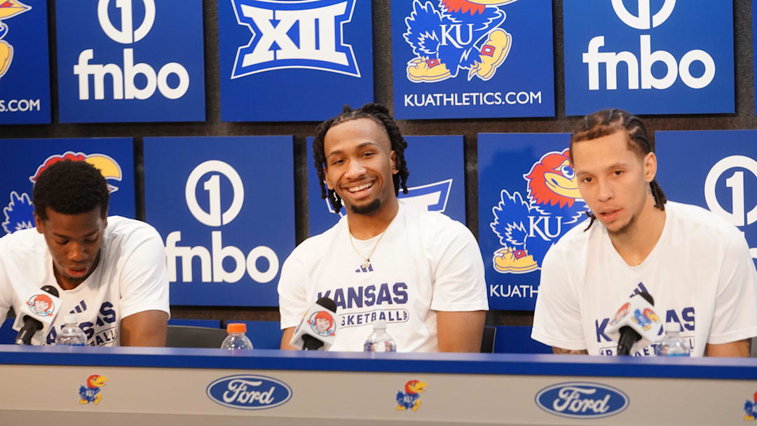 Kansas Jayhawks guard Melvin Council Jr. (14), Kansas Jayhawks guard Darryn Peterson (22) and Kansas Jayhawks guard Tre White (3) talks to the media following the game against Houston Cougars inside Allen Fieldhouse on Monday, Feb. 23, 2026.