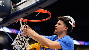 Florida guard Walter Clayton Jr. (1) cuts down his piece of the net as the team celebrates their win over Tennessee after the Southeastern Conference tournament championship at Bridgestone Arena in Nashville, Tenn., Sunday, March 16, 2025.