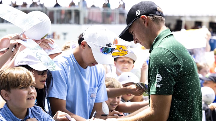 Jul 6, 2024; Silvis, Illinois, USA; Jordan Spieth signs autographs for fans during the third round of the John Deere Classic golf tournament. Mandatory Credit: Joseph Cress-Imagn Images Jul 6, 2024; Silvis, Illinois, USA; Jordan Spieth signs autographs for fans during the third round of the John Deere Classic golf tournament. Mandatory Credit: Joseph Cress-Imagn Images