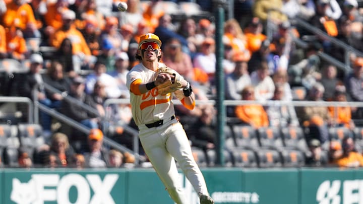 Tennessee infielder Manny Marin (4) throws the ball to first base during a Tennessee baseball game against Samford at Lindsey Nelson Stadium at the University of Tennessee on Sunday, February 23, 2025. Tennessee infielder Manny Marin (4) throws the ball to first base during a Tennessee baseball game against Samford at Lindsey Nelson Stadium at the University of Tennessee on Sunday, February 23, 2025.