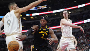 Feb 8, 2025; Chicago, Illinois, USA; Chicago Bulls center Nikola Vucevic (9) and guard Josh Giddey (3) defend Golden State Warriors guard Buddy Hield (7) during the first half at United Center. Mandatory Credit: David Banks-Imagn Images