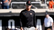Oklahoma State interim coach Doug Meacham walks on the field before a college football game between the Oklahoma State Cowboys (OSU) and the Houston Cougars at Boone Pickens Stadium in Stillwater, Okla., Saturday, Oct. 11, 2025.