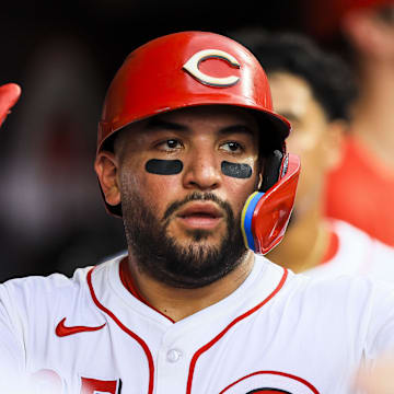 Aug 12, 2025; Cincinnati, Ohio, USA; Cincinnati Reds catcher Jose Trevino (35) high fives teammates after scoring on a two-run double hit by first baseman Spencer Steer (not pictured) in the third inning against the Philadelphia Phillies at Great American Ball Park. Mandatory Credit: Katie Stratman-Imagn Images