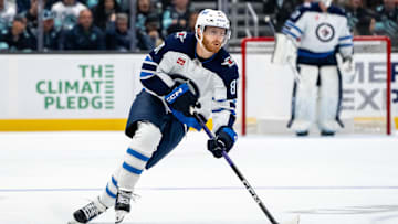 Oct 24, 2024; Seattle, Washington, USA;  Winnipeg Jets forward Kyle Connor (81) skates with the puck against the Seattle Kraken at Climate Pledge Arena. Mandatory Credit: Stephen Brashear-Imagn Images