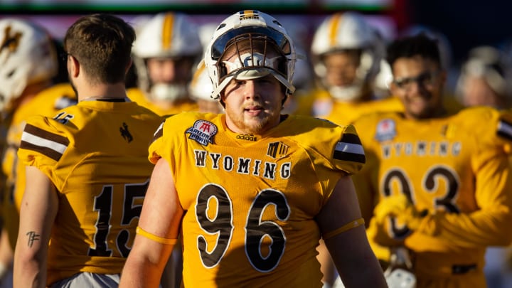 Dec 30, 2022; Tucson, AZ, USA; Wyoming Cowboys defensive tackle Jordan Bertagnole (96) against the Ohio Bobcats during the 2022 Barstool Sports Arizona Bowl at Arizona Stadium. Mandatory Credit: Mark J. Rebilas-USA TODAY Sports