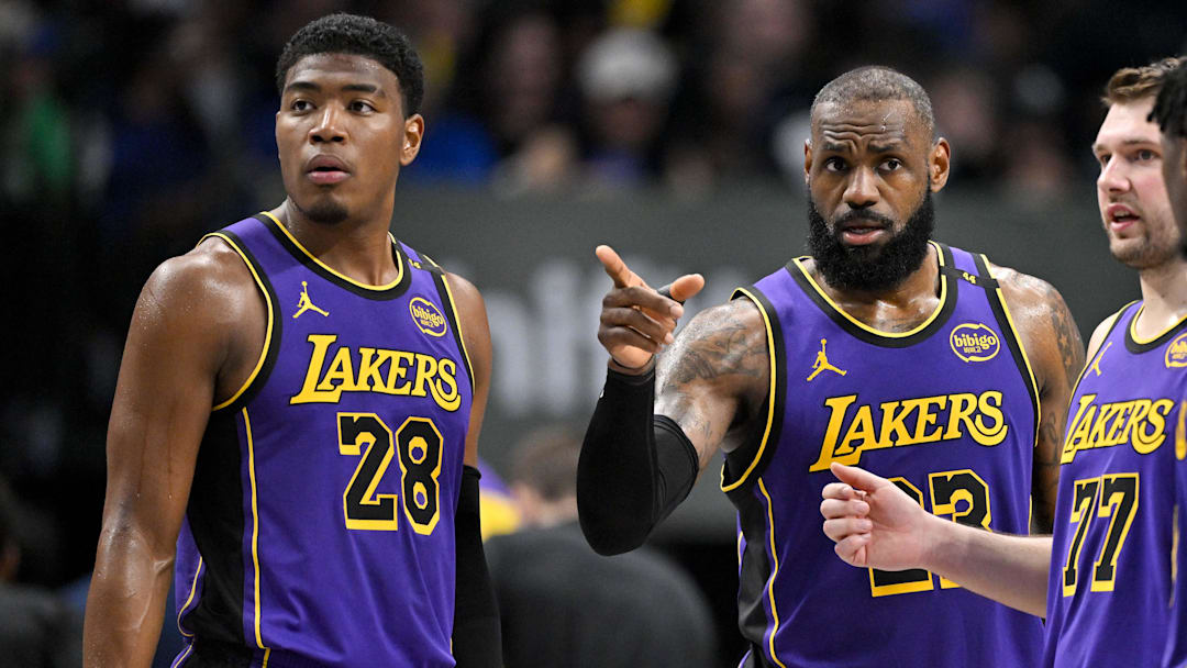 Apr 9, 2025; Dallas, Texas, USA; Los Angeles Lakers forward Rui Hachimura (28) and forward LeBron James (23) and guard Luka Doncic (77) during the game between the Dallas Mavericks and the Los Angeles Lakers at American Airlines Center. Mandatory Credit: Jerome Miron-Imagn Images