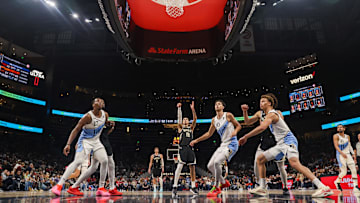 Milwaukee Bucks forward Kyle Kuzma shoots a free throw as Atlanta Hawks forward Onyeka Okongwu and forward Zaccharie Risacher and guard Dyson Daniels box out in the first half at State Farm Arena on February 7.