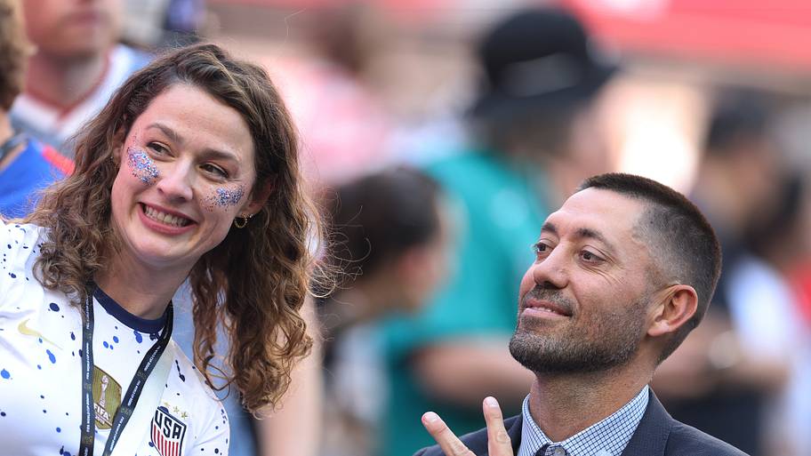 Clint Dempsey (right) posing with a fan.