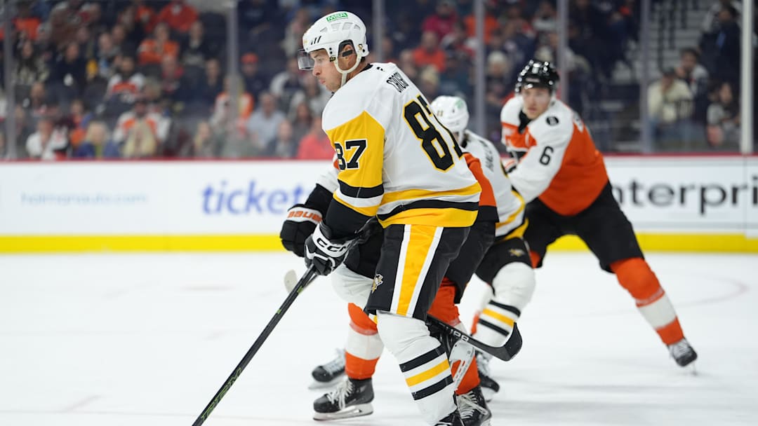 Oct 28, 2025; Philadelphia, Pennsylvania, USA; Pittsburgh Penguins center Sidney Crosby (87) deflects a shot against the Philadelphia Flyers in the second period at Xfinity Mobile Arena. Mandatory Credit: Kyle Ross-Imagn Images