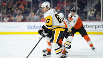 Oct 28, 2025; Philadelphia, Pennsylvania, USA; Pittsburgh Penguins center Sidney Crosby (87) deflects a shot against the Philadelphia Flyers in the second period at Xfinity Mobile Arena. Mandatory Credit: Kyle Ross-Imagn Images