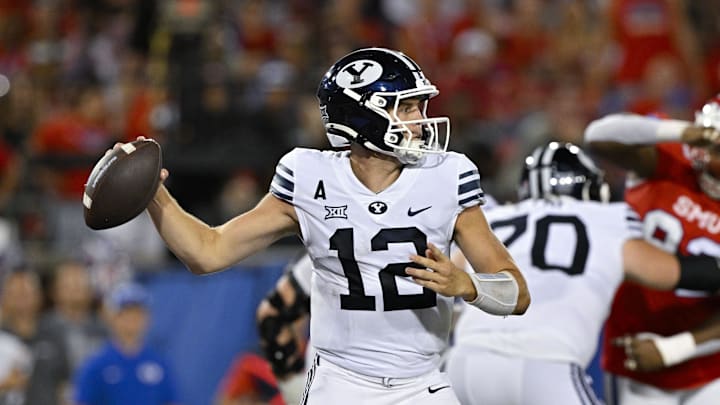 Sep 6, 2024; Dallas, Texas, USA; Brigham Young Cougars quarterback Jake Retzlaff (12) passes the ball against the Southern Methodist Mustangs during the second half at Gerald J. Ford Stadium. Mandatory Credit: Jerome Miron-Imagn Images