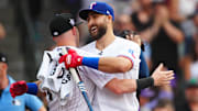 Texas Rangers right fielder Joey Gallo is greeted by Colorado Rockies shortstop Trevor Story during the 2021 MLB Home Run Derby. 