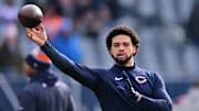 Dec 22, 2024; Chicago, Illinois, USA; Chicago Bears quarterback Caleb Williams (18) warms up before a game against the Detroit Lions at Soldier Field. Mandatory Credit: Daniel Bartel-Imagn Images