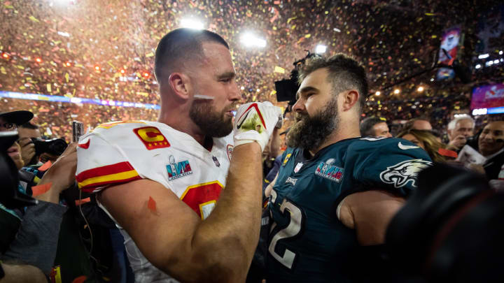 Feb 12, 2023; Glendale, Arizona, US; Kansas City Chiefs tight end Travis Kelce (87) talks with his brother Philadelphia Eagles center Jason Kelce (62) after Super Bowl LVII at State Farm Stadium. Mandatory Credit: Mark J. Rebilas-USA TODAY Sports