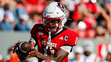 Oct 4, 2025; Raleigh, North Carolina, USA; NC State Wolfpack quarterback CJ Bailey (11) catches the ball during the second half of the game against Campbell Fighting Camels at Carter-Finley Stadium. Mandatory Credit: Jaylynn Nash-Imagn Images