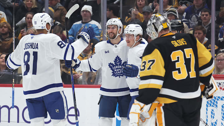 Nov 29, 2025; Pittsburgh, Pennsylvania, USA;  Toronto Maple Leafs center Dakota Joshua (81) and center Nicolas Roy (middle) congratulate center Bobby McMann (74) on his goal against Pittsburgh Penguins goaltender Arturs Silovs (37) during the second period at PPG Paints Arena. Mandatory Credit: Charles LeClaire-Imagn Images