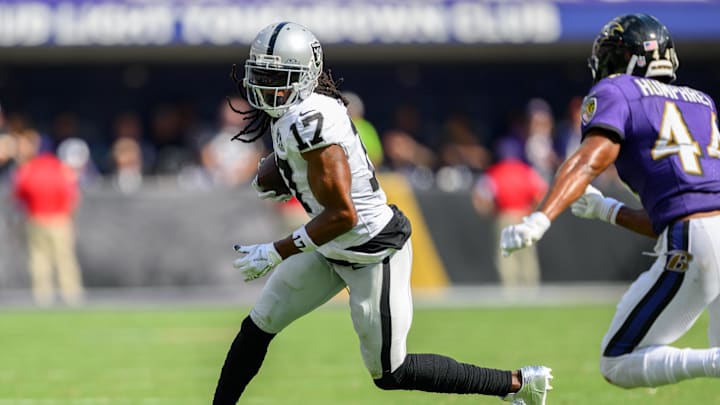 Sep 15, 2024; Baltimore, Maryland, USA; Las Vegas Raiders wide receiver Davante Adams (17) runs with the ball as Baltimore Ravens cornerback Marlon Humphrey (44) defends during the second half at M&T Bank Stadium. Mandatory Credit: Reggie Hildred-Imagn Images