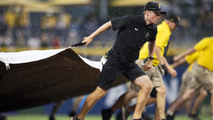 Jul 1, 2023; Pittsburgh, Pennsylvania, USA; The Pittsburgh Pirates grounds crew pull the tarp onto the field during a rain delay in the ninth inning against the Milwaukee Brewers at PNC Park. Mandatory Credit: Scott Galvin-Imagn Images Jul 1, 2023; Pittsburgh, Pennsylvania, USA; The Pittsburgh Pirates grounds crew pull the tarp onto the field during a rain delay in the ninth inning against the Milwaukee Brewers at PNC Park. Mandatory Credit: Scott Galvin-Imagn Images