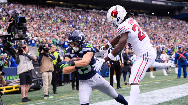 Oct 22, 2023; Seattle, Washington, USA; Seattle Seahawks wide receiver Jake Bobo (19) catches a pass for a touchdown over Arizona Cardinals cornerback Starling Thomas V (24) during the first half at Lumen Field. Mandatory Credit: Steven Bisig-USA TODAY Sports