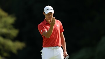 Collin Morikawa reading a putt at the Zozo Championship.
