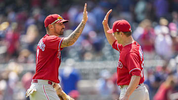 Philadelphia Phillies right fielder Nick Castellanos (8) reacts with relief pitcher David Robertson (30) the Phillies defeated the Atlanta Braves at Truist Park on Aug. 3, 2022.