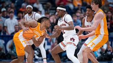 Tennessee guard Chaz Lanier (2) is guarded by Auburn guard Joah Shay (12) during the first half of their semifinal game of the SEC Men's Basketball Tournament at Bridgestone Arena in Nashville, Tenn., Saturday, March 15, 2025.