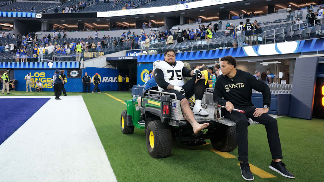 New Orleans Saints RT Taliese Fuaga (75) gets carted off the field during a game against the Los Angeles Rams on Nov. 2, 2025.