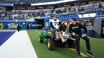 New Orleans Saints RT Taliese Fuaga (75) gets carted off the field during a game against the Los Angeles Rams on Nov. 2, 2025.