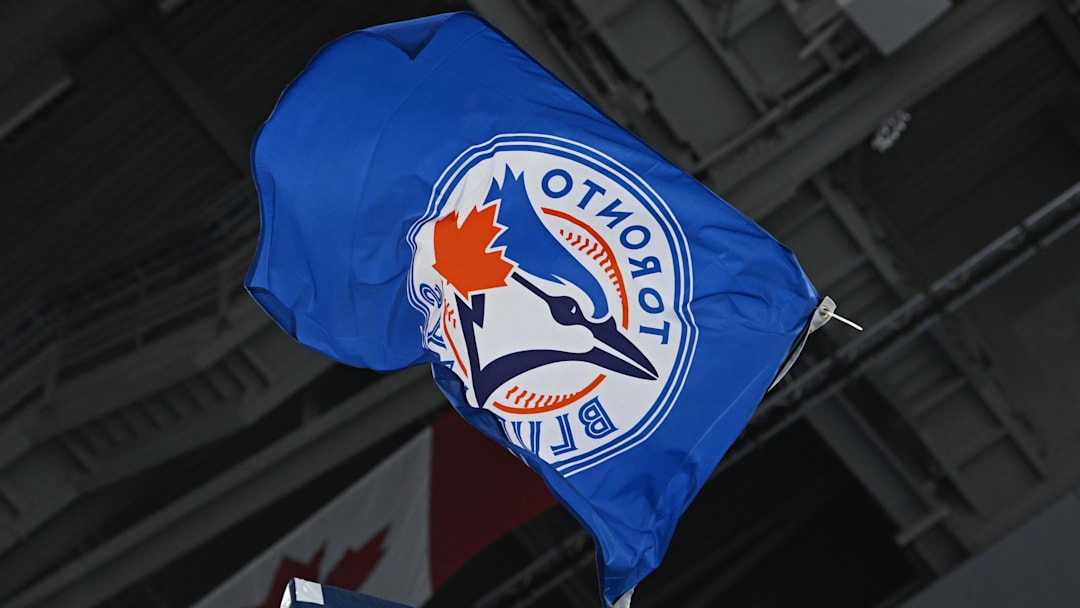 The Toronto Blue Jays flag is waves