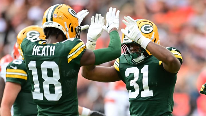 Green Bay Packers running back Emanuel Wilson (31) celebrates with wide receiver Malik Heath (18) after scoring a touchdown at the Cleveland Browns.