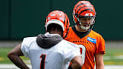 Cincinnati Bengals quarterback Joe Burrow talks with wide receiver Ja'Marr Chase during an off-season workout.