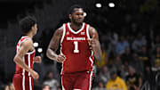 Nov 23, 2023; La Jolla, California, USA; Oklahoma Sooners forward John Hugley IV (1) gestures after