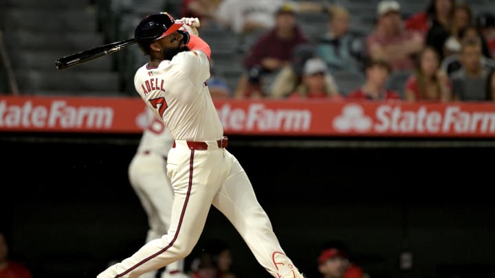 Jul 30, 2024; Anaheim, California, USA; Los Angeles Angels right fielder Jo Adell (7) hits a solo home run in the seventh inning against the Colorado Rockies at Angel Stadium. Mandatory Credit: Jayne Kamin-Oncea-USA TODAY Sports