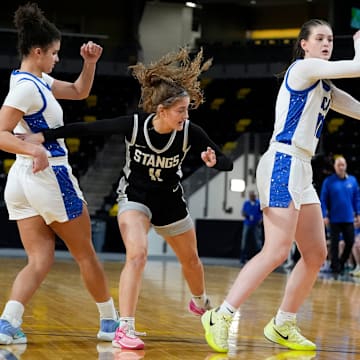 Clear Creek Amana's Averie Lower (10) looks to pass against the Mount Vernon Mustangs during a girls basketball game Tuesday, Feb. 11, 2025 at Xtream Arena in Coralville, Iowa.
