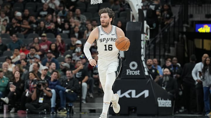 Jan 29, 2024; San Antonio, Texas, USA; San Antonio Spurs forward Cedi Osman (16) dribbles up the court in the first half against the Washington Wizards at Frost Bank Center. 