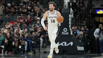Jan 29, 2024; San Antonio, Texas, USA;  San Antonio Spurs forward Cedi Osman (16) dribbles up the court in the first half against the Washington Wizards at Frost Bank Center. Mandatory Credit: Daniel Dunn-Imagn Images