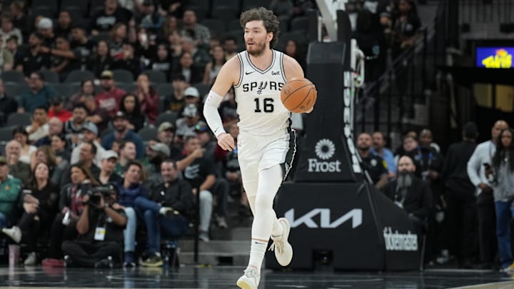 Jan 29, 2024; San Antonio, Texas, USA;  San Antonio Spurs forward Cedi Osman (16) dribbles up the court in the first half against the Washington Wizards at Frost Bank Center. Mandatory Credit: Daniel Dunn-Imagn Images