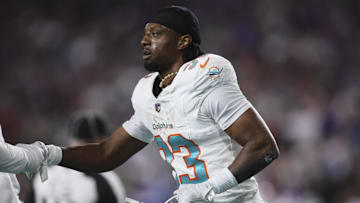 Jan 7, 2024; Miami Gardens, Florida, USA; Miami Dolphins cornerback Eli Apple (33) celebrates after intercepting the football against the Buffalo Bills during the first quarter at Hard Rock Stadium. Mandatory Credit: Sam Navarro-Imagn Images