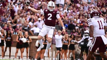 Aug 31, 2024; Starkville, Mississippi, USA; Mississippi State Bulldogs quarterback Blake Shapen (2) jumps into the endzone against Eastern Kentucky Colonels linebacker Maddox Marcellus (11) during the first quarter at Davis Wade Stadium at Scott Field. Mandatory Credit: Matt Bush-USA TODAY Sports