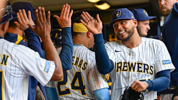 Jul 13, 2025; Milwaukee, Wisconsin, USA;  Milwaukee Brewers starting pitcher Freddy Peralta (51) is greeted in the dugout after pitching six plus innings against the Washington Nationals at American Family Field. Mandatory Credit: Benny Sieu-Imagn Images