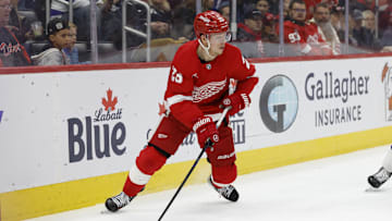 Feb 8, 2025; Detroit, Michigan, USA;  Detroit Red Wings left wing Lucas Raymond (23) skates with the puck in the second period against the Tampa Bay Lightning at Little Caesars Arena. Mandatory Credit: Rick Osentoski-Imagn Images
